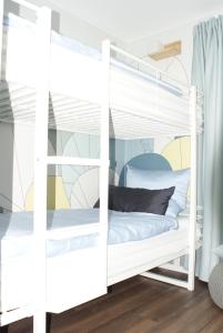 Postel nebo postele na pokoji v ubytování Zeitlos in Waldkirchen + 15 fotografií