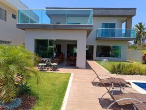 Aed väljaspool majutusasutust Barra de Jacuípe - Condomínio Parque Jacuípe -Mansão Caldeira