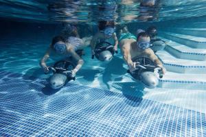 a group of people in a swimming pool wearing goggles at Swift Retreat - Haven Wild Duck Holiday Park in Belton