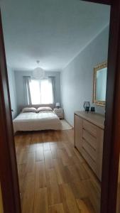 Ένα ή περισσότερα κρεβάτια σε δωμάτιο στο Apartament Spokojna 12