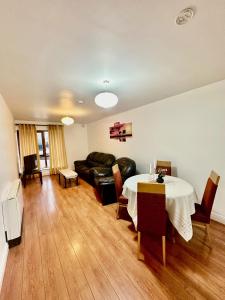 a living room with a table and a couch at Saint Saviour's Apt Waterford in Waterford