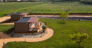 an aerial view of a cabin in the middle of a field at Val di Venere Glamp House in Santa Maria in Stelle