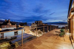 - Balcón con silla en la parte superior de un edificio en Gente del Sur - Fique, en Ushuaia