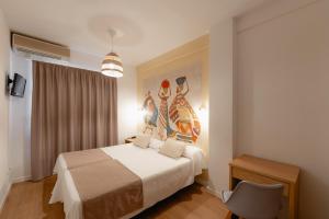 Postel nebo postele na pokoji v ubytování Hotel Internacional