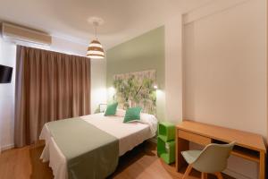 Postel nebo postele na pokoji v ubytování Hotel Internacional