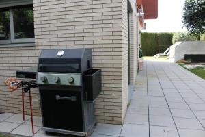 a grill sitting on the side of a building at Residentium Spain -Chalet la Dorada pets friendly in Cambrils