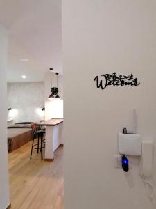a white room with a desk and a dining room at Urban Loft in Lido di Ostia