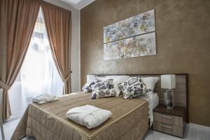 ローマにあるPia Domusのベッドルーム1室(大型ベッド1台、枕付)
