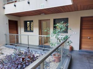 a house with a staircase leading to the front door at Misterhost Triana Remedios 2BR & parking in Seville