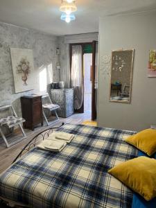Ένα ή περισσότερα κρεβάτια σε δωμάτιο στο Casa Alessia