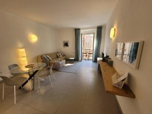 a living room with a table and a couch at Le Terrazze in Tropea