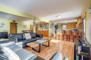 a living room with a couch and a table at Delton Lake House with Boat Dock Fish, Swim and More! in Orangeville