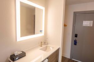 a bathroom with a sink and a mirror at Comfort Inn Battle Mountain in Battle Mountain