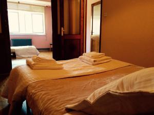 Postel nebo postele na pokoji v ubytování Apartment Lugo Rooms