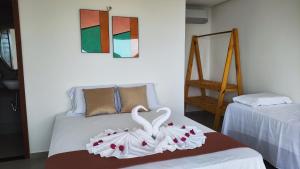 Ένα ή περισσότερα κρεβάτια σε δωμάτιο στο Makani Beach House +10 φωτογραφίες