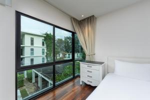 Ένα ή περισσότερα κρεβάτια σε δωμάτιο στο The Title Condo by Tropiclook +180 φωτογραφίες