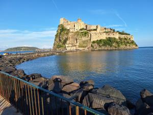 a castle on top of an island in the water at GUEST HOME in Casamicciola Terme