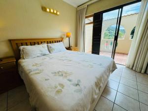 Ένα ή περισσότερα κρεβάτια σε δωμάτιο στο 12 Bay Sands +25 φωτογραφίες