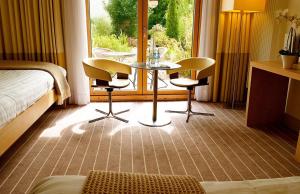 Uma área de estar em Lifehouse Spa And Hotel