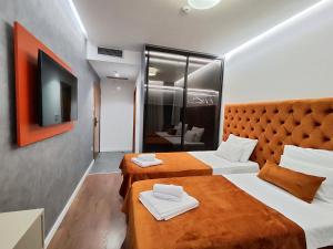 Krevet ili kreveti u jedinici u okviru objekta Lolo Luxury rooms & suites