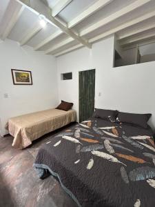 a bedroom with two beds in a room at Casa de jose in Manizales