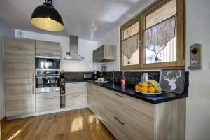 Kuchyň nebo kuchyňský kout v ubytování Résidence Le Refuge De L'hermine - Appartement La Terrasse - 8 Personnes - Morzine MAE-3951 + 5 fotografií