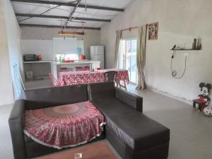 a living room with a couch and a table at Casa de campo in Vaqueros