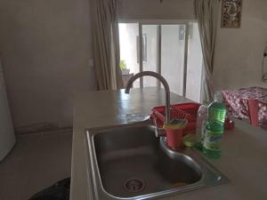 a kitchen counter with a sink in a kitchen at Casa de campo in Vaqueros