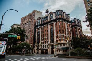 a large red brick building on a city street at Hotel Belleclaire Central Park in New York