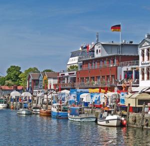 a group of boats are docked in a harbor at Pension Ostsee-Strand in Börgerende-Rethwisch