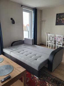 A bed or beds in a room at Apartament Płocka 2