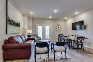a living room with a couch and a table at NEW Const Sleeps 6 Pool - close to Pkwy in Pigeon Forge