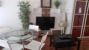 TV a/nebo společenská místnost v ubytování Studio cosy 33 m² limite Lyon. Parking privatif.