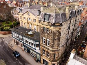 an overhead view of an old building on a city street at The Resolution Hotel in Whitby