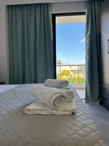 Cama ou camas em um quarto em Noa Boutique Hotel