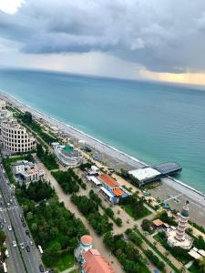 an aerial view of a beach and the ocean at Orbi City Sea View in Batumi