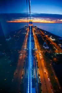 an overhead view of a highway at night at Orbi City Sea View in Batumi