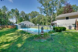 a yard with a fence and a swimming pool at Saratoga Springs Haven with Pool and Fire Pit! in Saratoga Springs