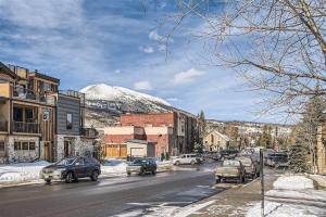 a street in a town with a snow covered mountain at Condos Off Main 15 condo in Frisco