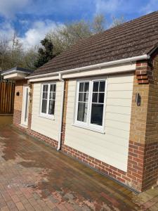 a detached house with a garage at Savannah Lodge in Wyke Regis