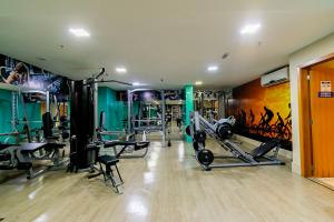 a gym with several tread machines in a room at GS Properties - Nobile Monumental in Brasilia