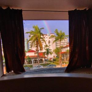 a view of a rainbow from a window at Spa Chaac in Puerto Vallarta