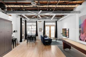 a living room with a couch and a table at Hotel Residential of Denver in Denver