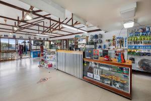 a grocery store aisle with a lot of products at Reflections Lake Burrendong - Holiday Park in Mumbil