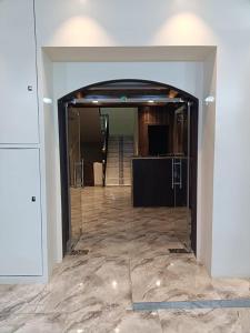 a hallway with a glass door in a building at سرر المحمديه البطحاء in Riyadh