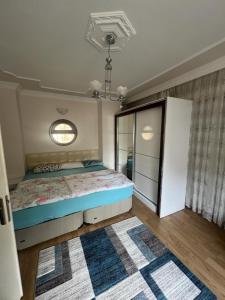 a bedroom with a bed and a window at CN Villa Didim in Didim