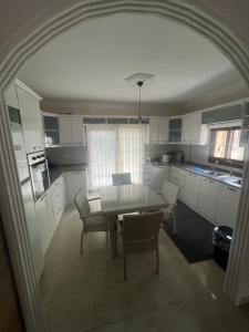 an overhead view of a kitchen with a table and chairs at CN Villa Didim in Didim