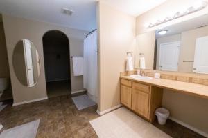 a bathroom with a sink and a large mirror at Cozy home - sleeps 12 - RV parking - Sun Room in Star