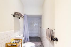 a bathroom with a toilet and a shower at Casa Alexia in Guadalajara +125 photos