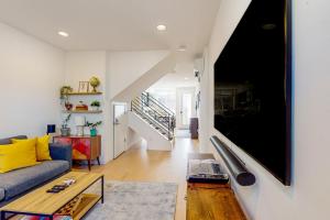 a living room with a couch and a table at Urban Oasis in Seattle